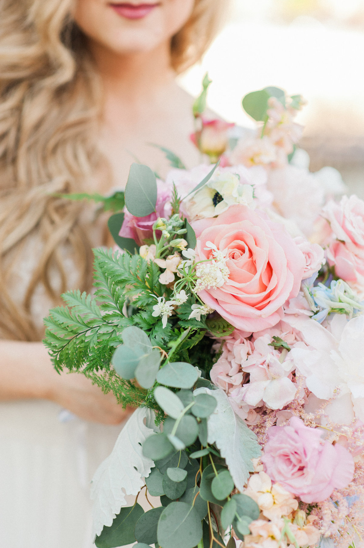 bride-holding-pink-flowers-photo