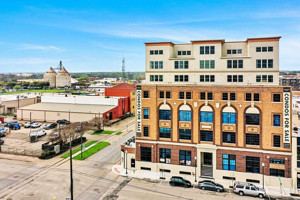 Historic Behrens Lofts building that holds this 2 bedroom, 2.5 bathroom luxury vacation rental loft condo for 8 guests with incredible downtown views, free parking, free wifi and professional decor in downtown Waco, TX.