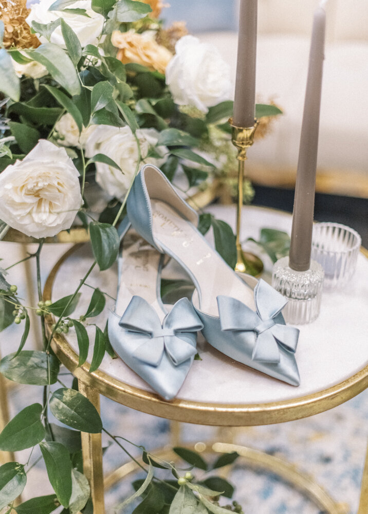 blue bridal shoes and white flowers
