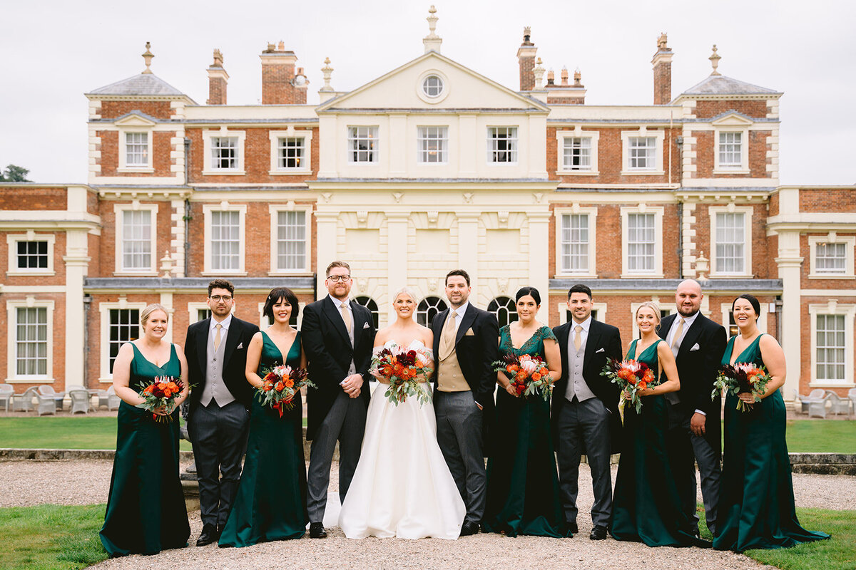 group photo of the bridal party outside hawkstone hall