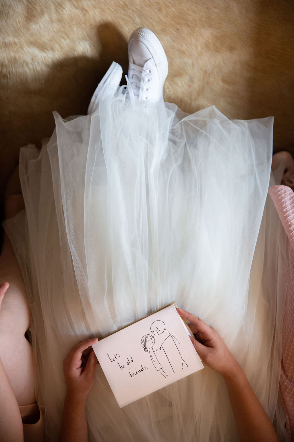 Close up view of a bride holding a hand-made card.