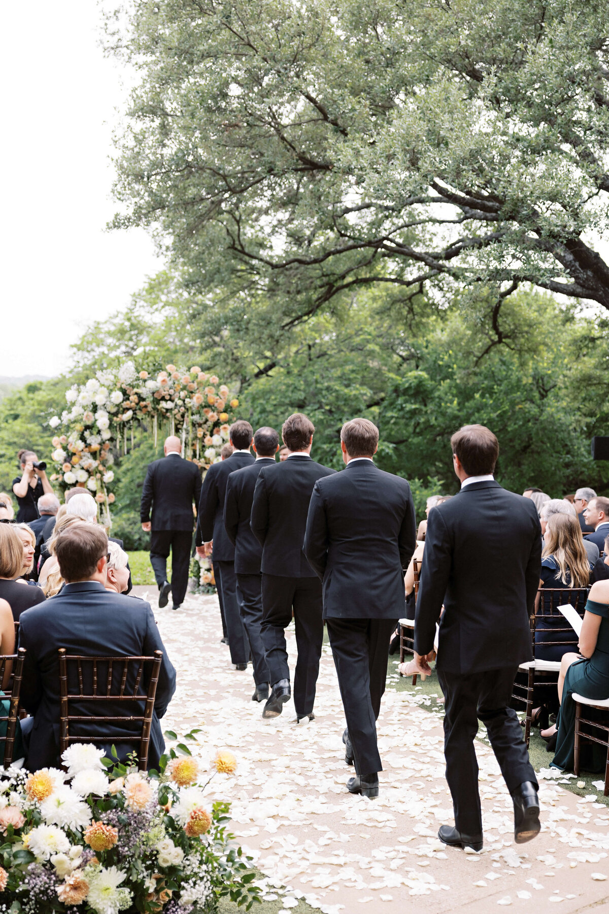 grooms in classic black suits