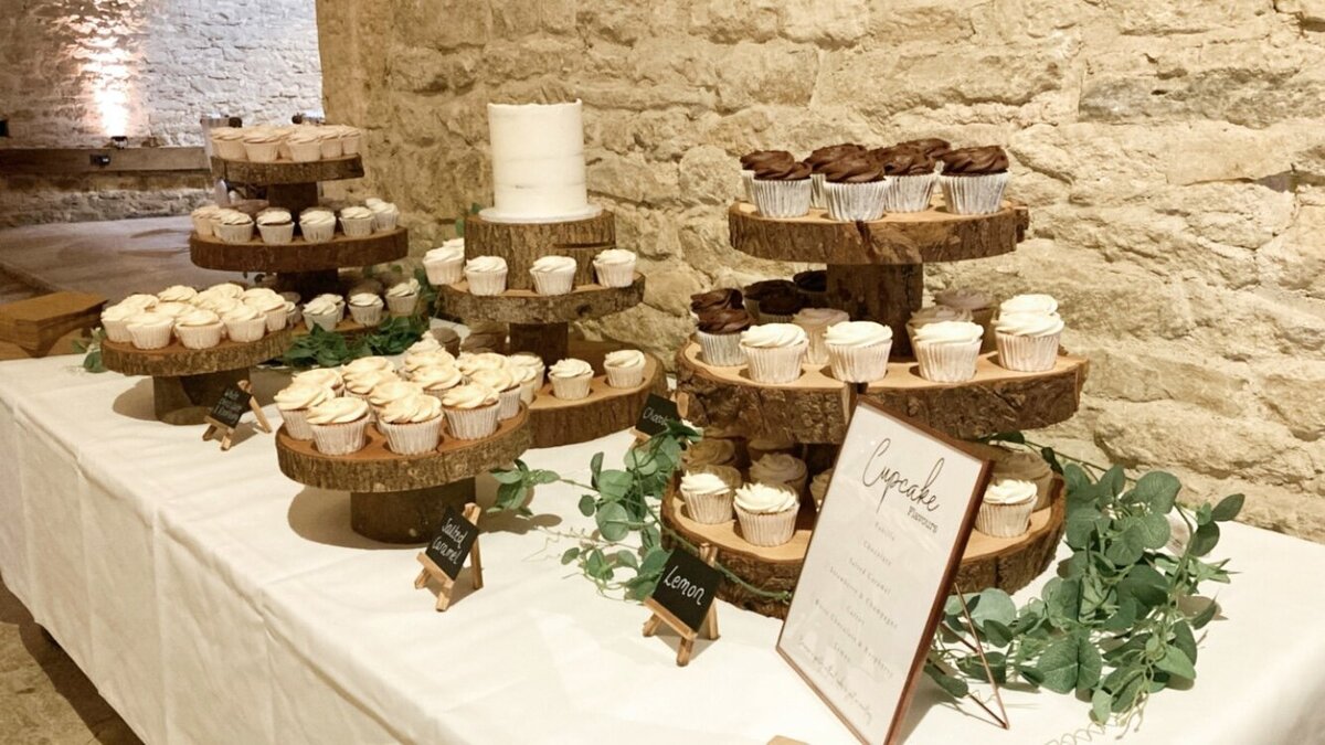 Rustic dessert table with cupcakes and single tier cake Oxfordshire The Cotswolds
