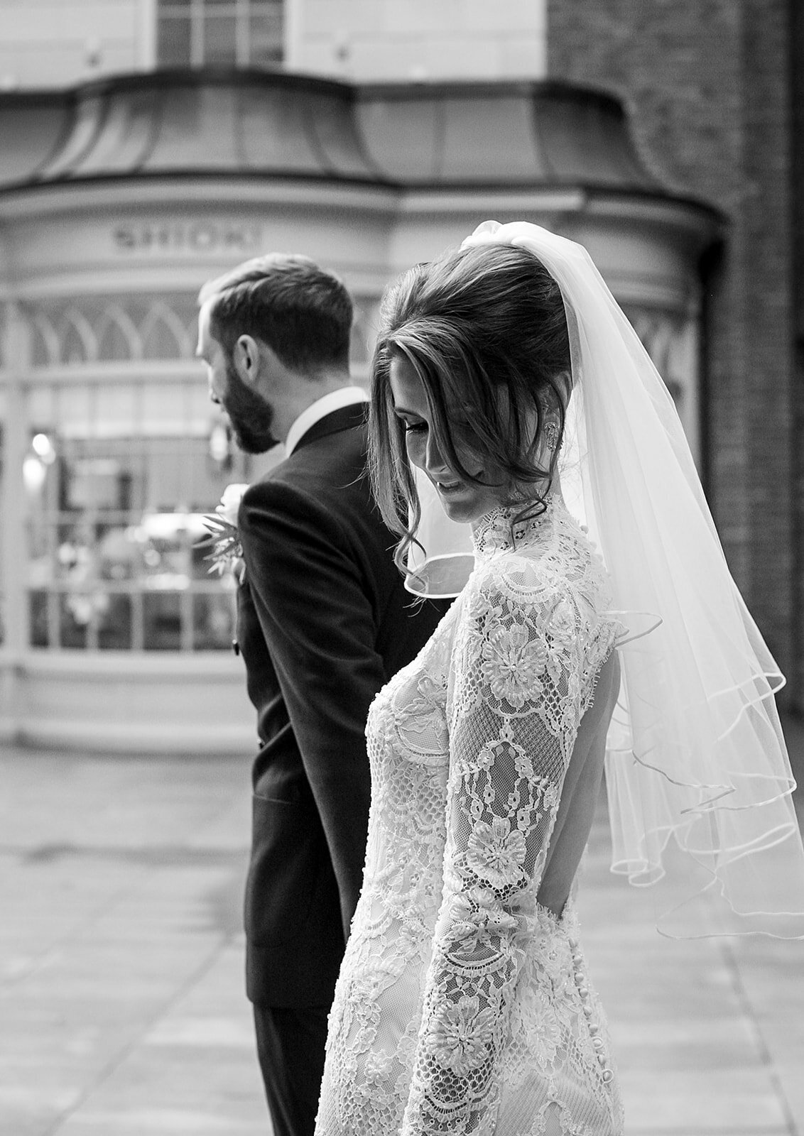 Bride walks through London with groom