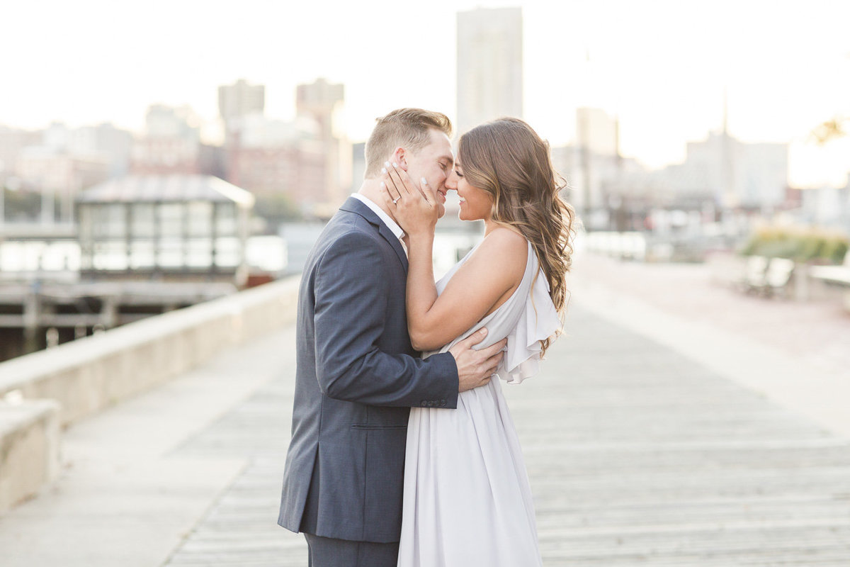 couple in Charlestown Navy Yard with Boston skyline in background