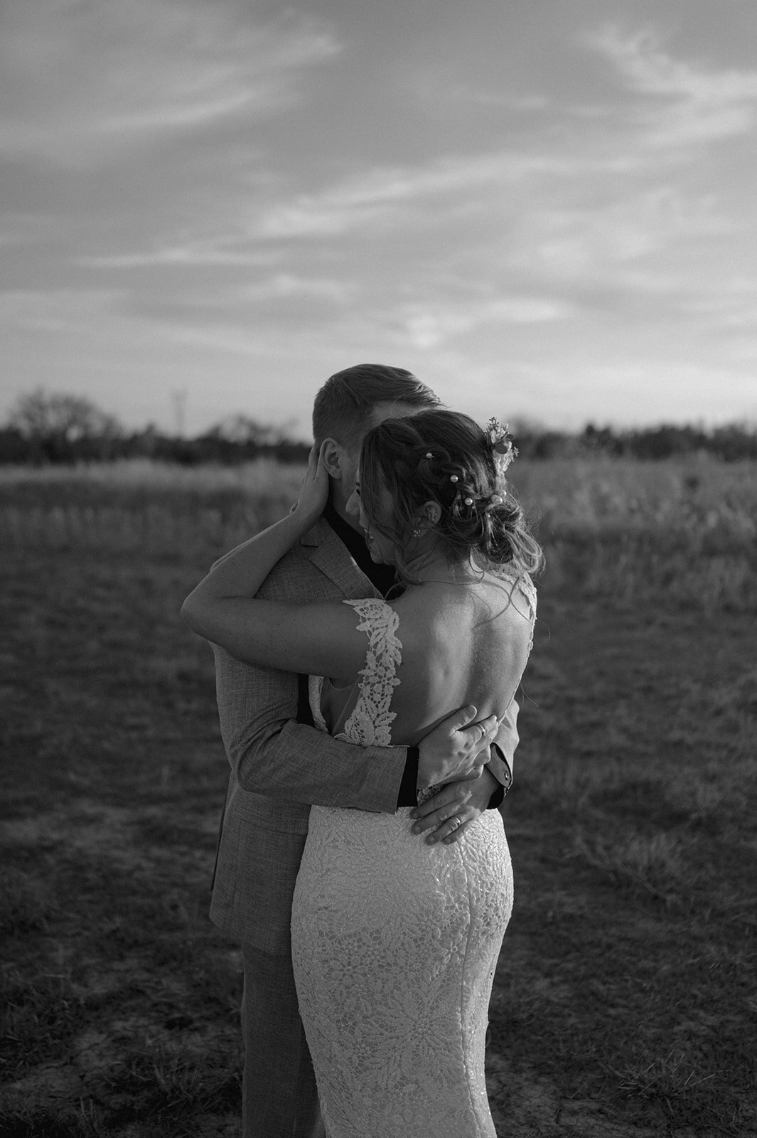 bride and groom hugging during golden hour wedding day photos at the baumberhof