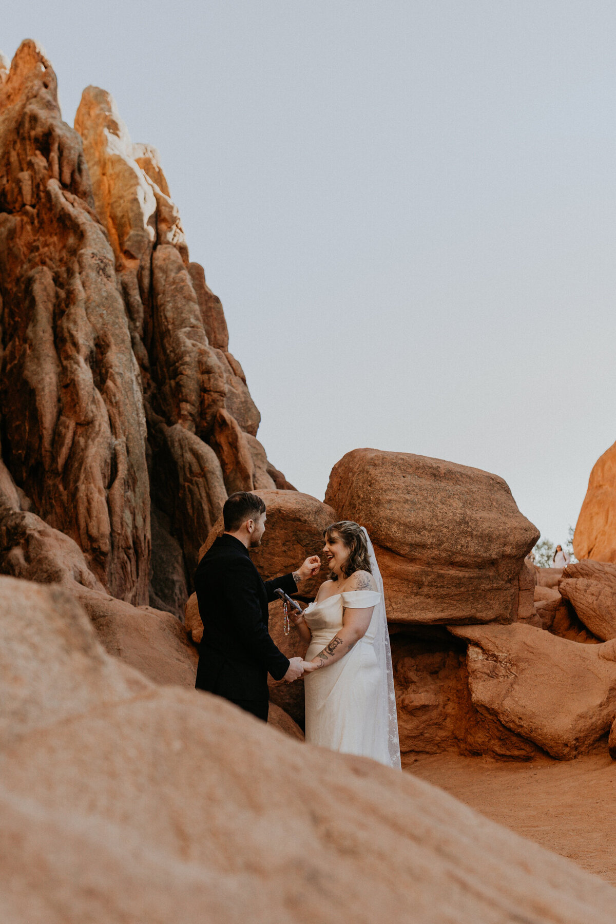 bride and groom having their ceremony at Garden of the Gods park