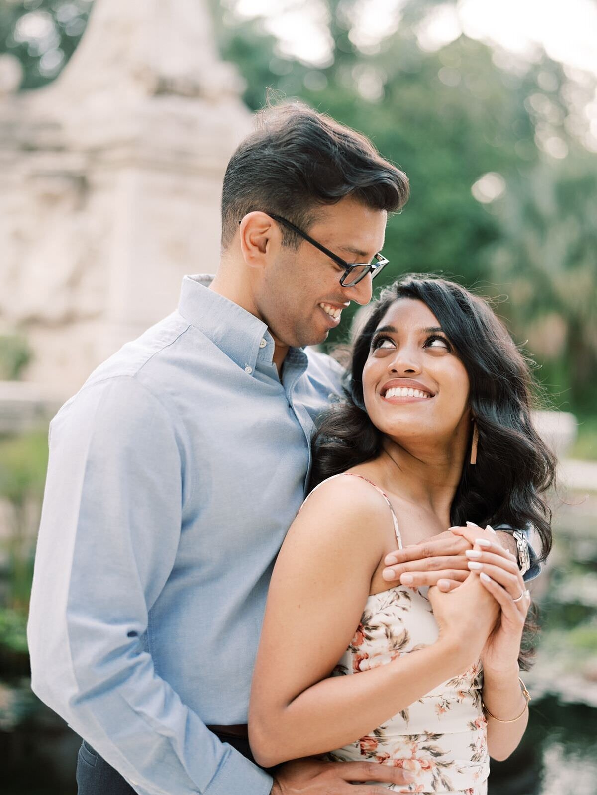 engaged-couple-smiling-at-each-other-during-engagement-photos-at-vizcaya-museum-with-Sarah-Sunstrom-Photography