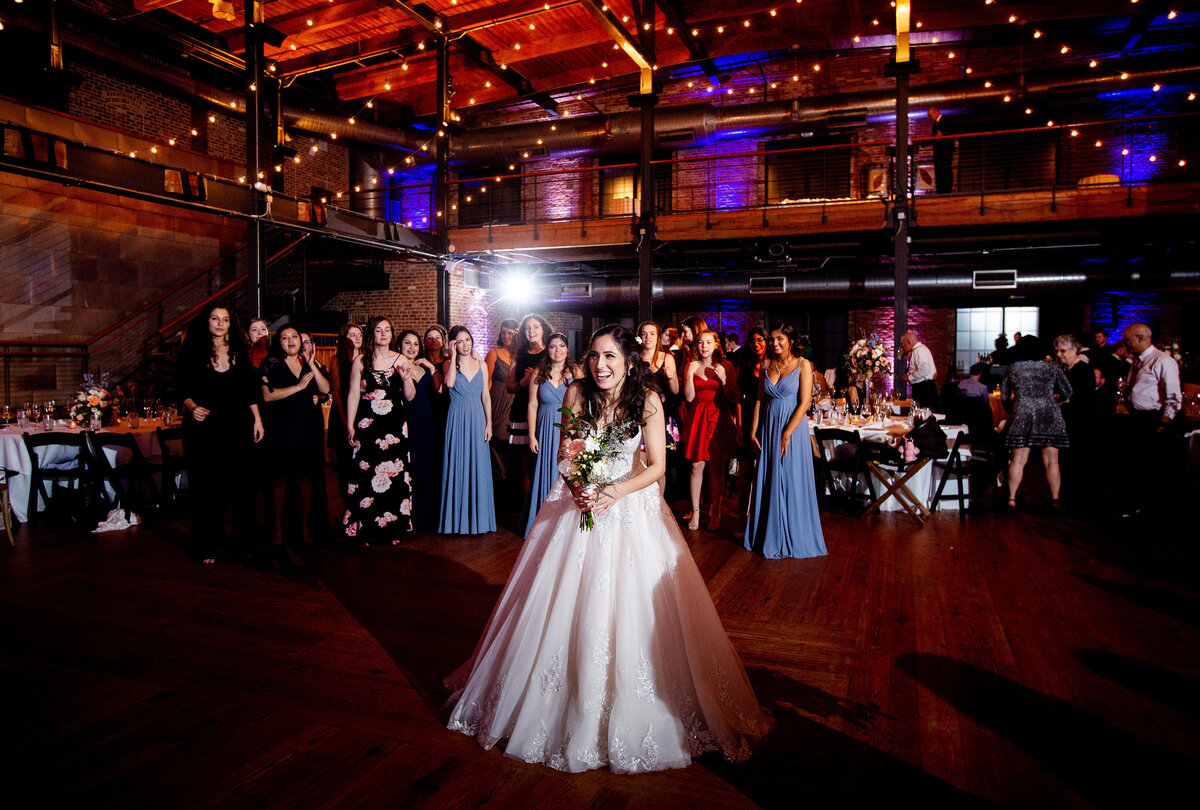 Bouquet toss and wedding reception in Durham, NC at Bay 7
