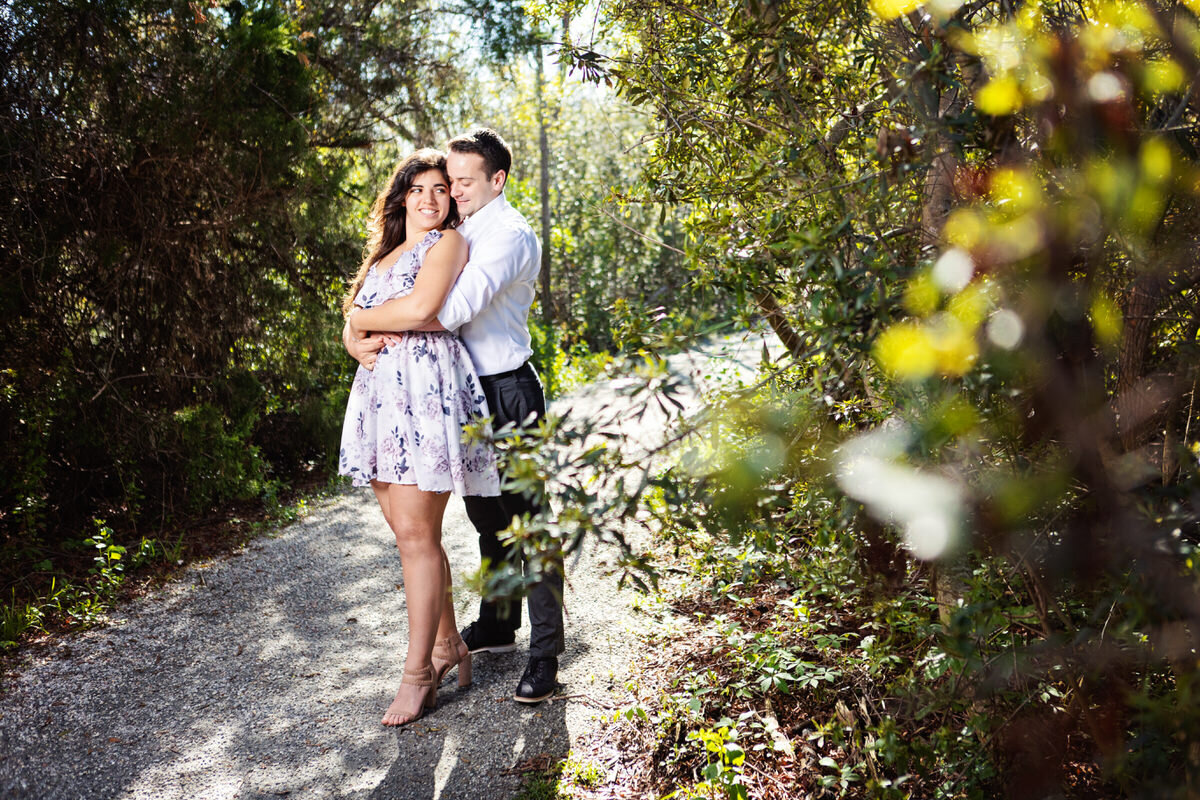 Couple embracing at Stono River Park Engagement Session Charleston Wedding Photographer