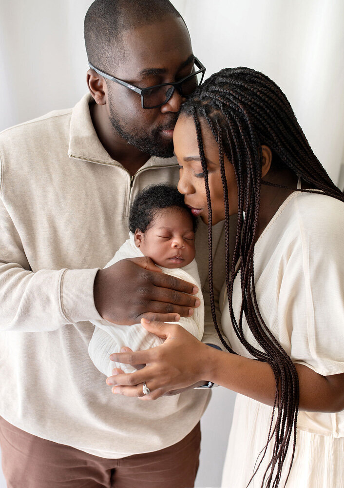 Newborn session of baby girl with parents