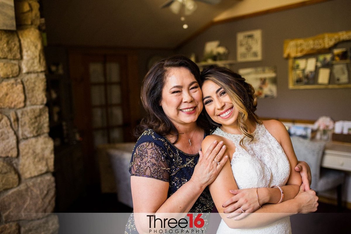 Bride shares a moment with her mom before her wedding
