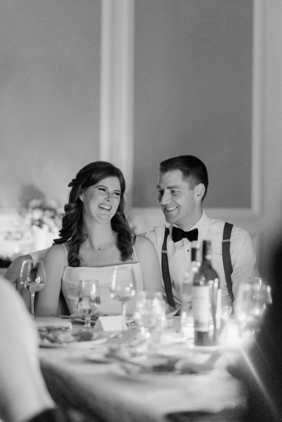 Bride and groom sitting down at wedding reception table at  Lord Nelson Hotel Wedding, in Halifax, Nova Scotia