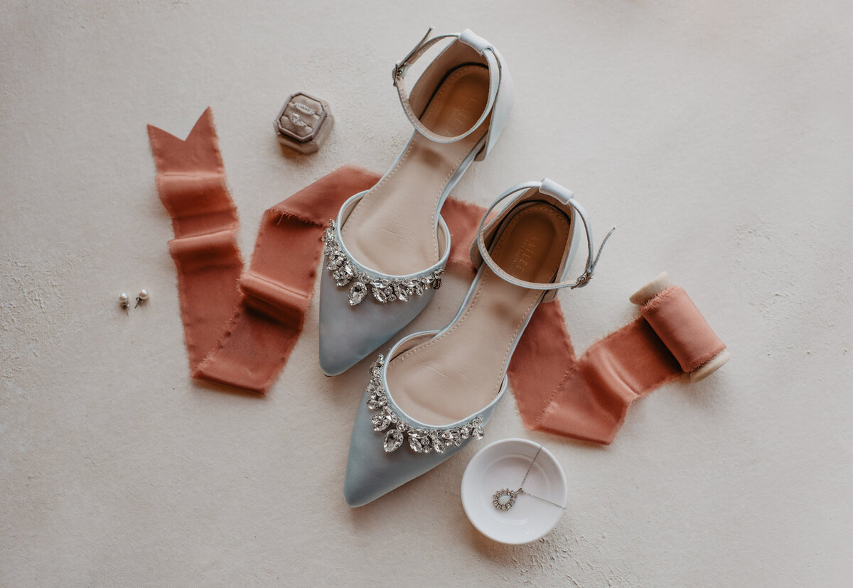 Photographers Jackson Hole capture bride's shoes and jewelry before Grand Teton wedding