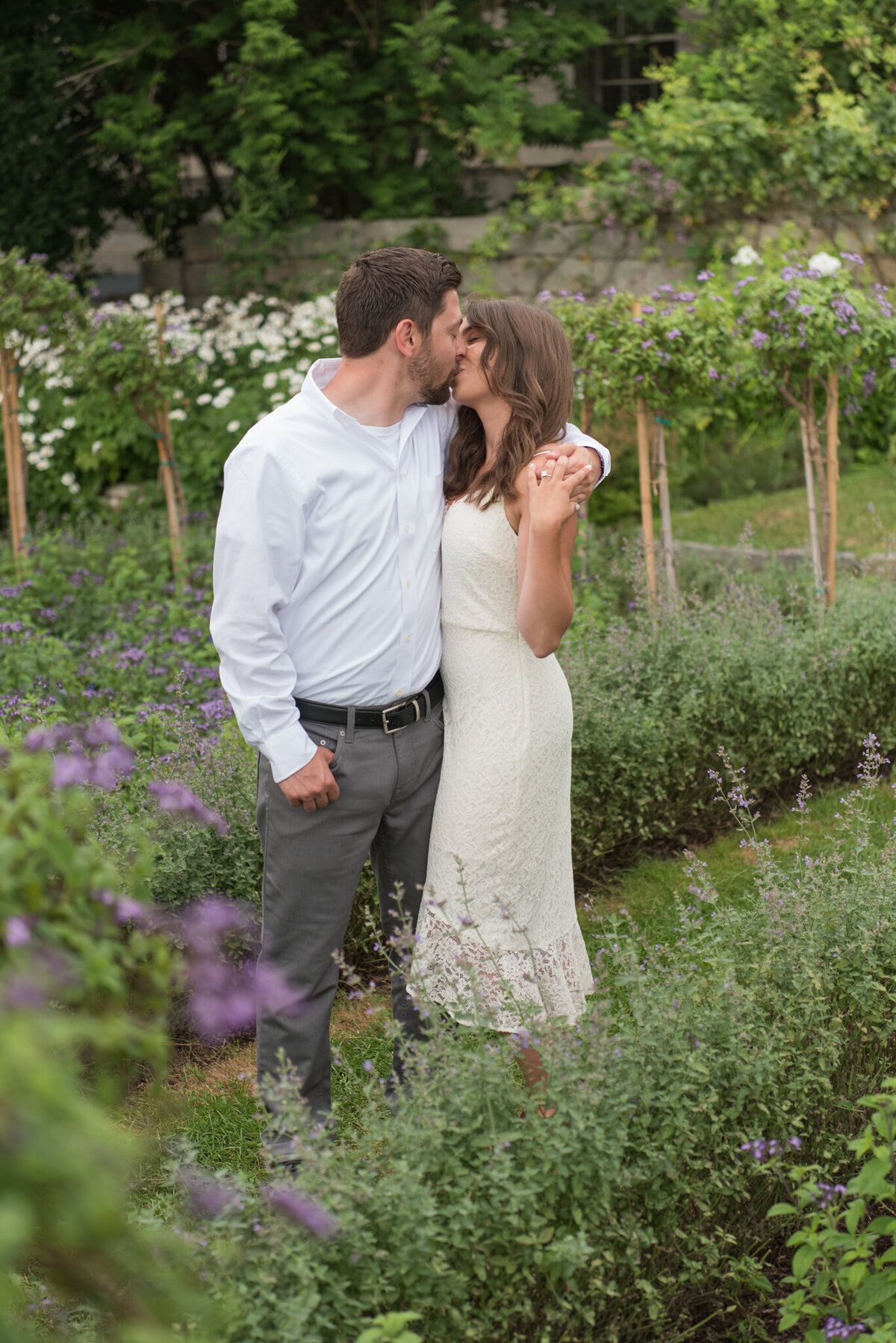 Couple kissing in green garden