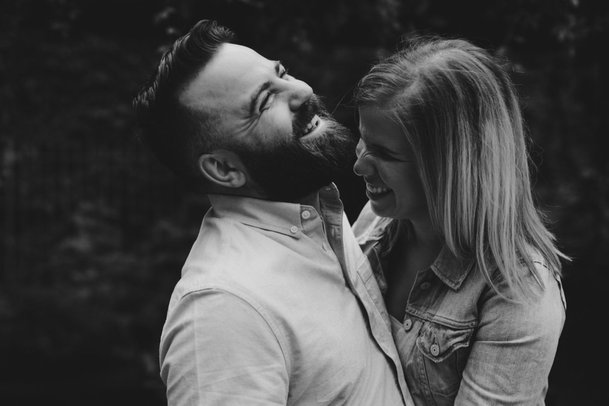laughing couple in black and white