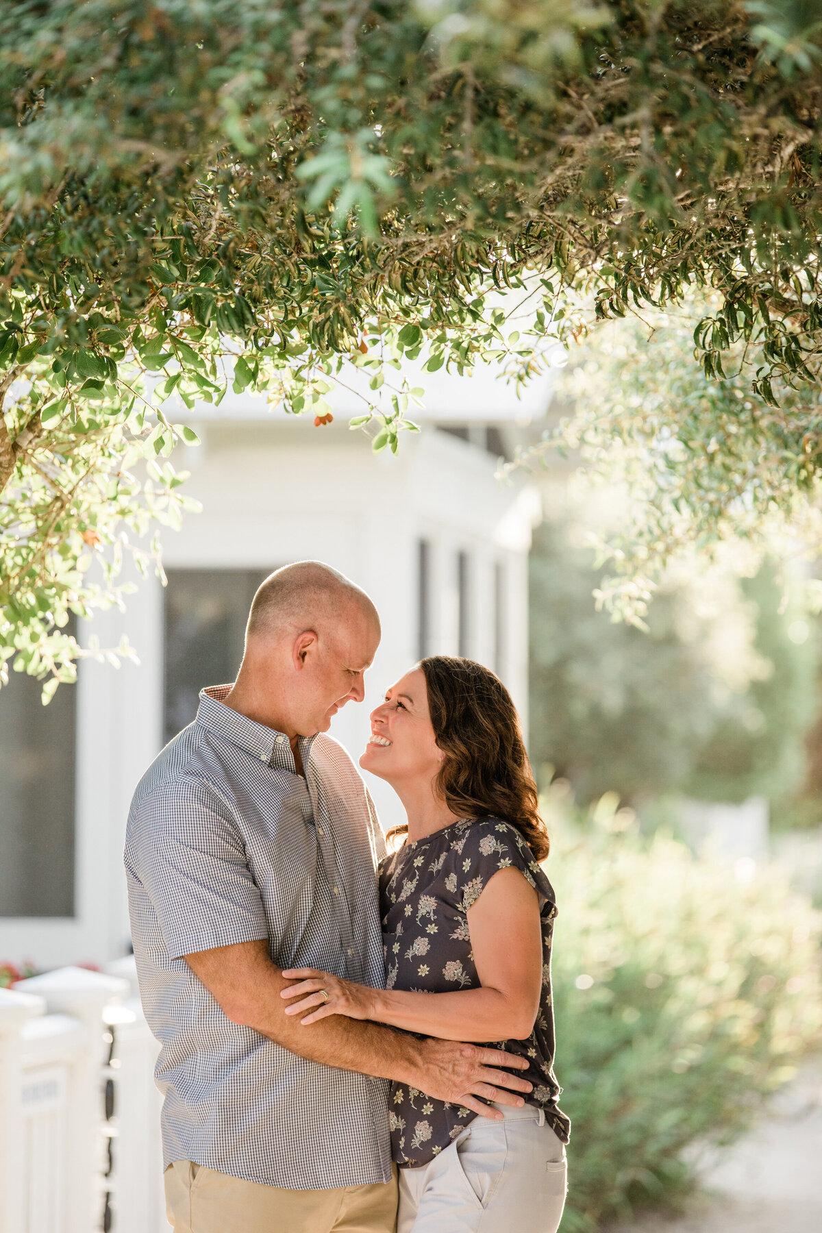 A couple looking up at each other smiling