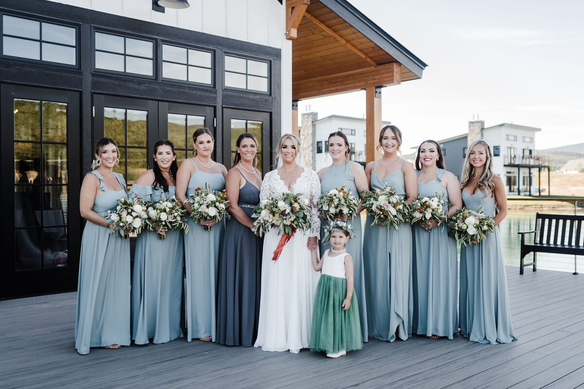 Bridal party standing with flowers at Lakehouse in Thornton, NH