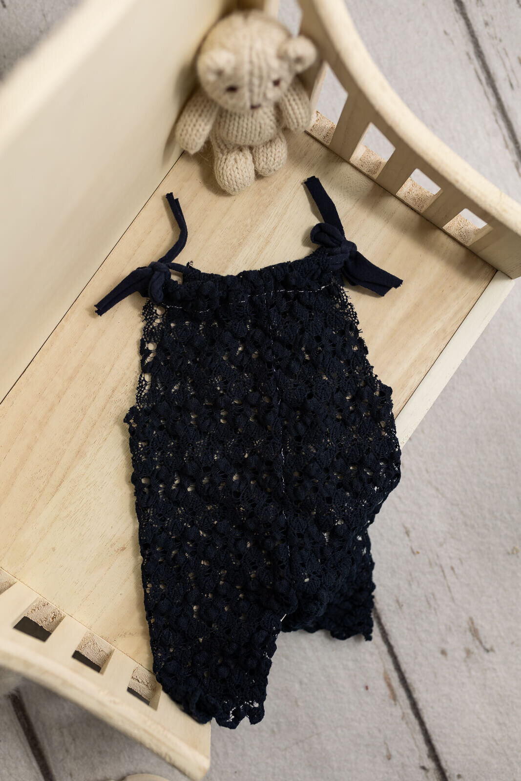 Beautiful lace navy blue romper for baby girl studio session in New Ulm, Minnesota.