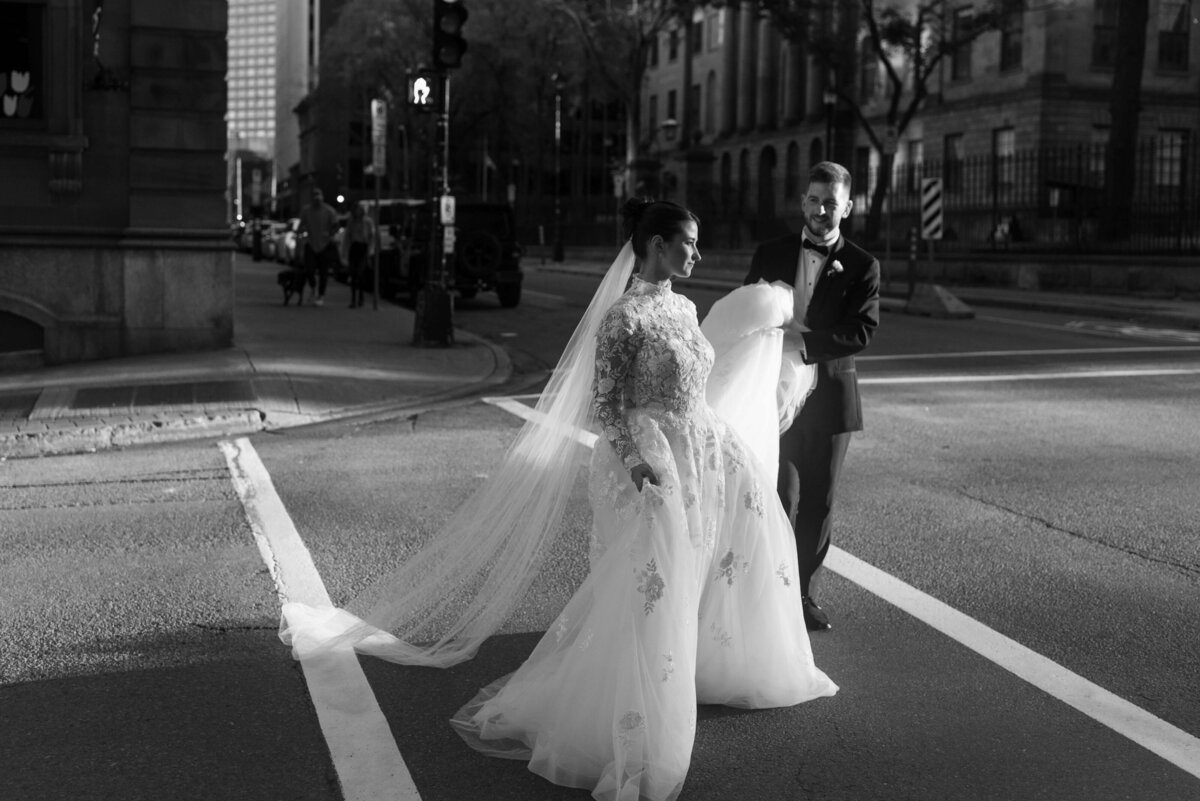 Bride and groom crossing street in Halifax, Nova Scotia