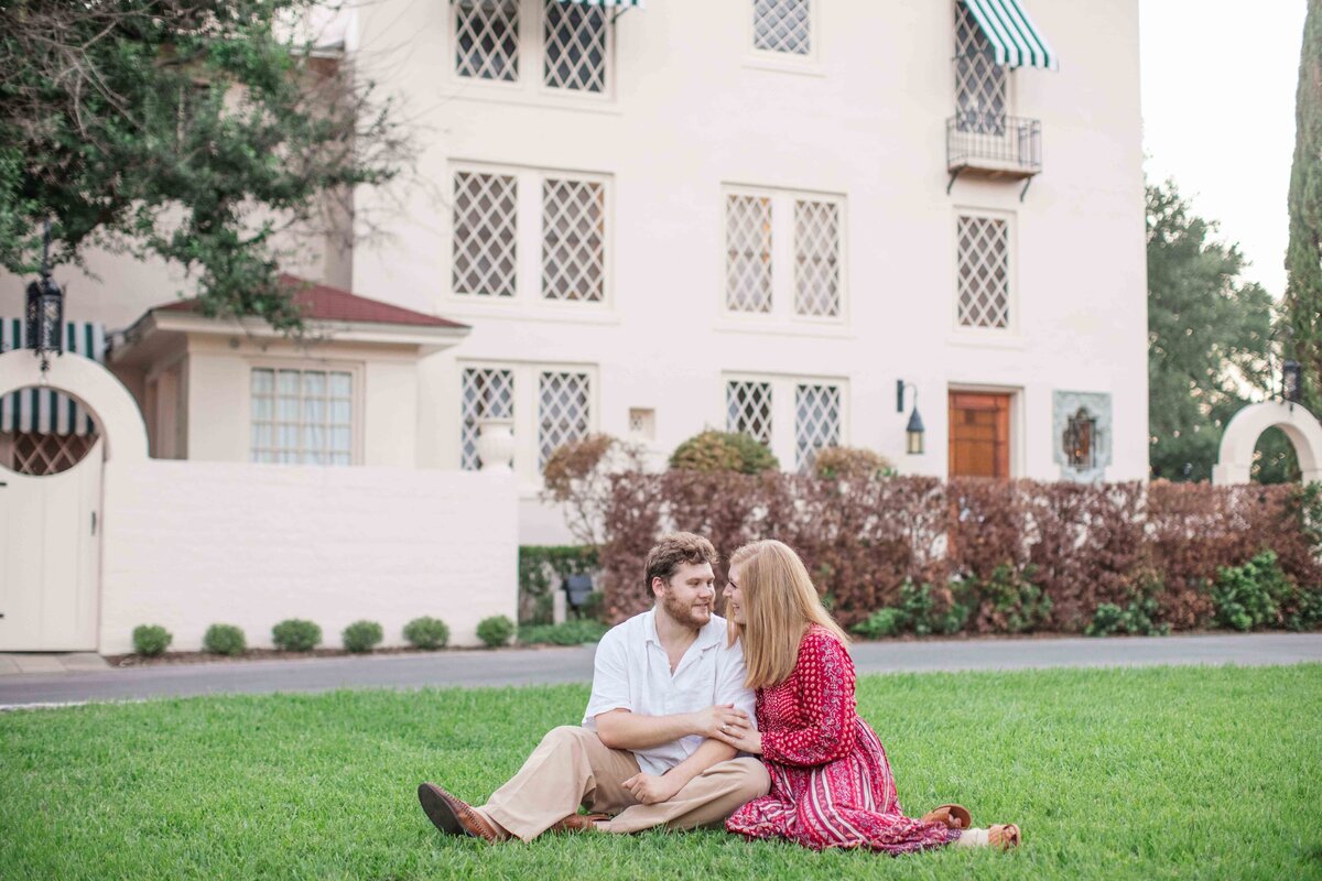engagement session with red dress and Austin museum by Texas wedding photographer Firefly