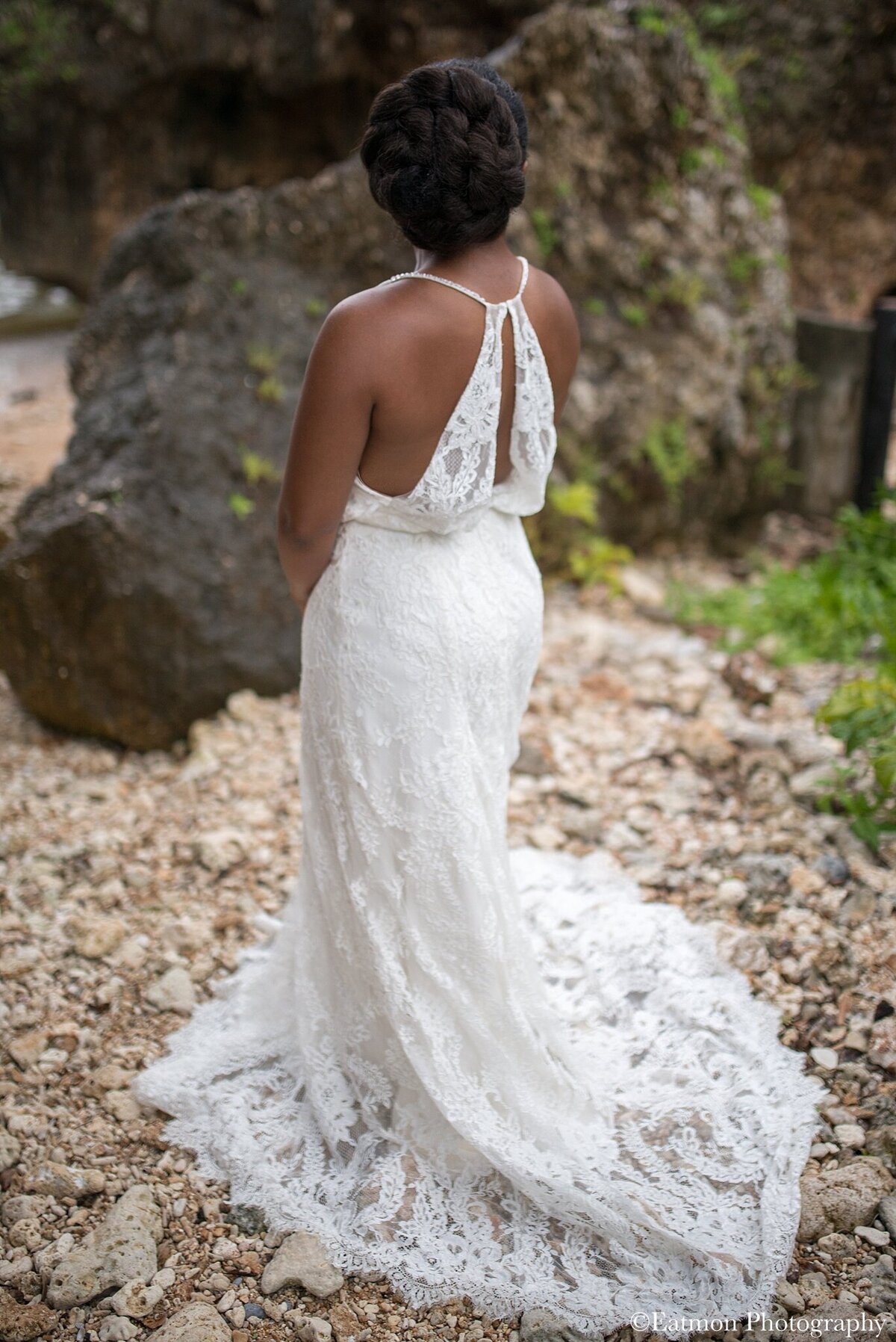 The romantic floral lace and short train of the Sabine wedding dress style make it a good bridal option for a beach elopement wedding ceremony.
