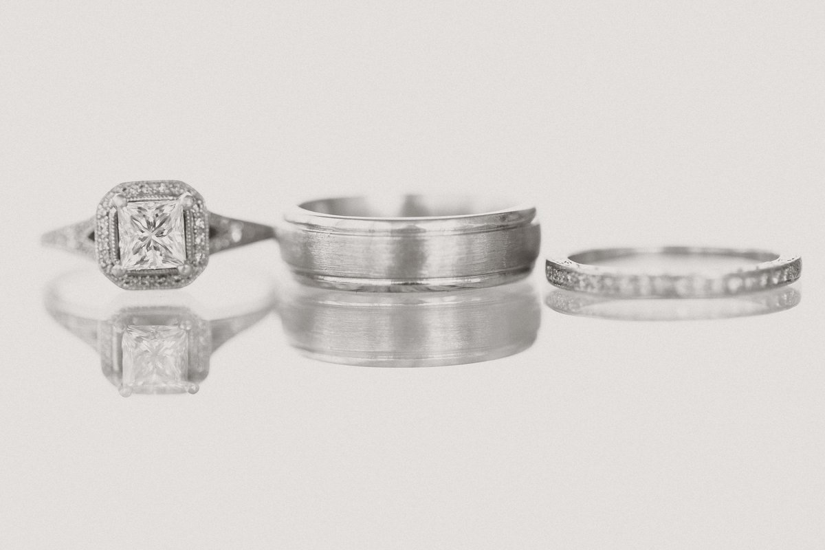 Engagment ring, and two wedding bands lined up at D'amore Indianapolis