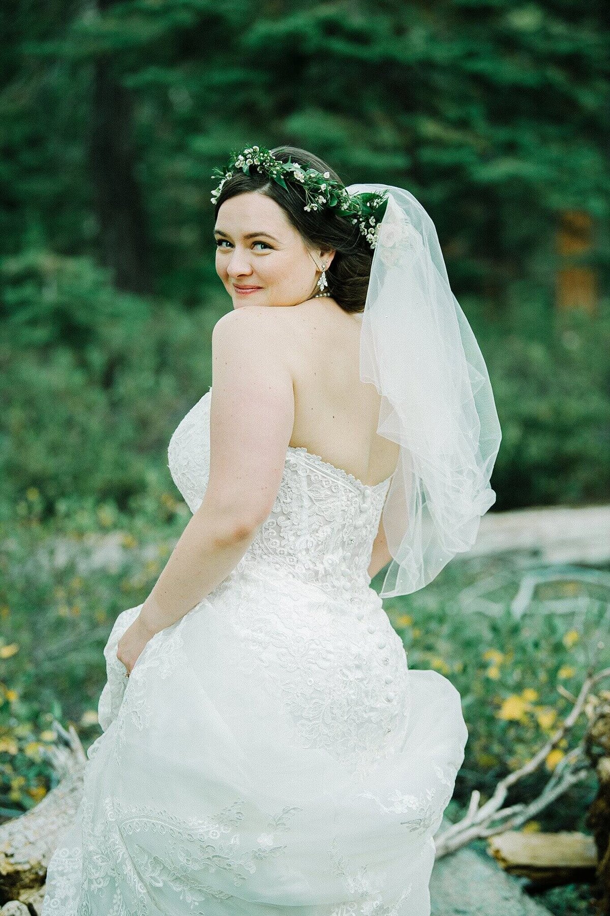 bride looking over the shoulder with veil at lake Tahoe wedding