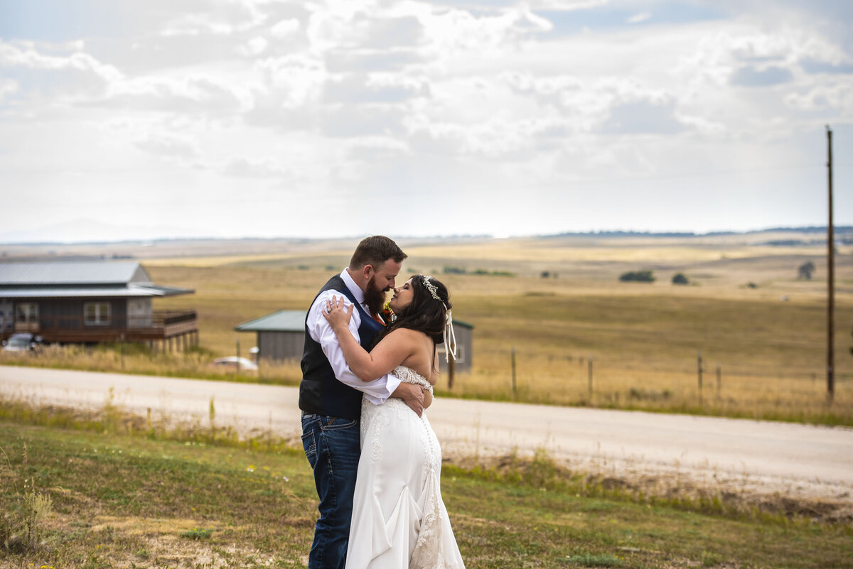 Newlyweds waling at eastern ranch after ceremony for wedding portraits