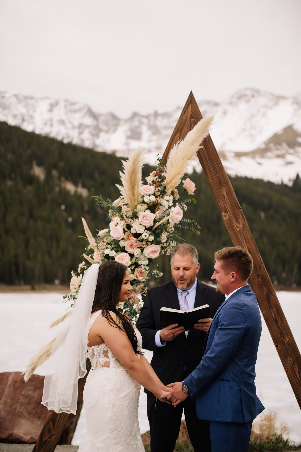 winter elopement photos during ceremony