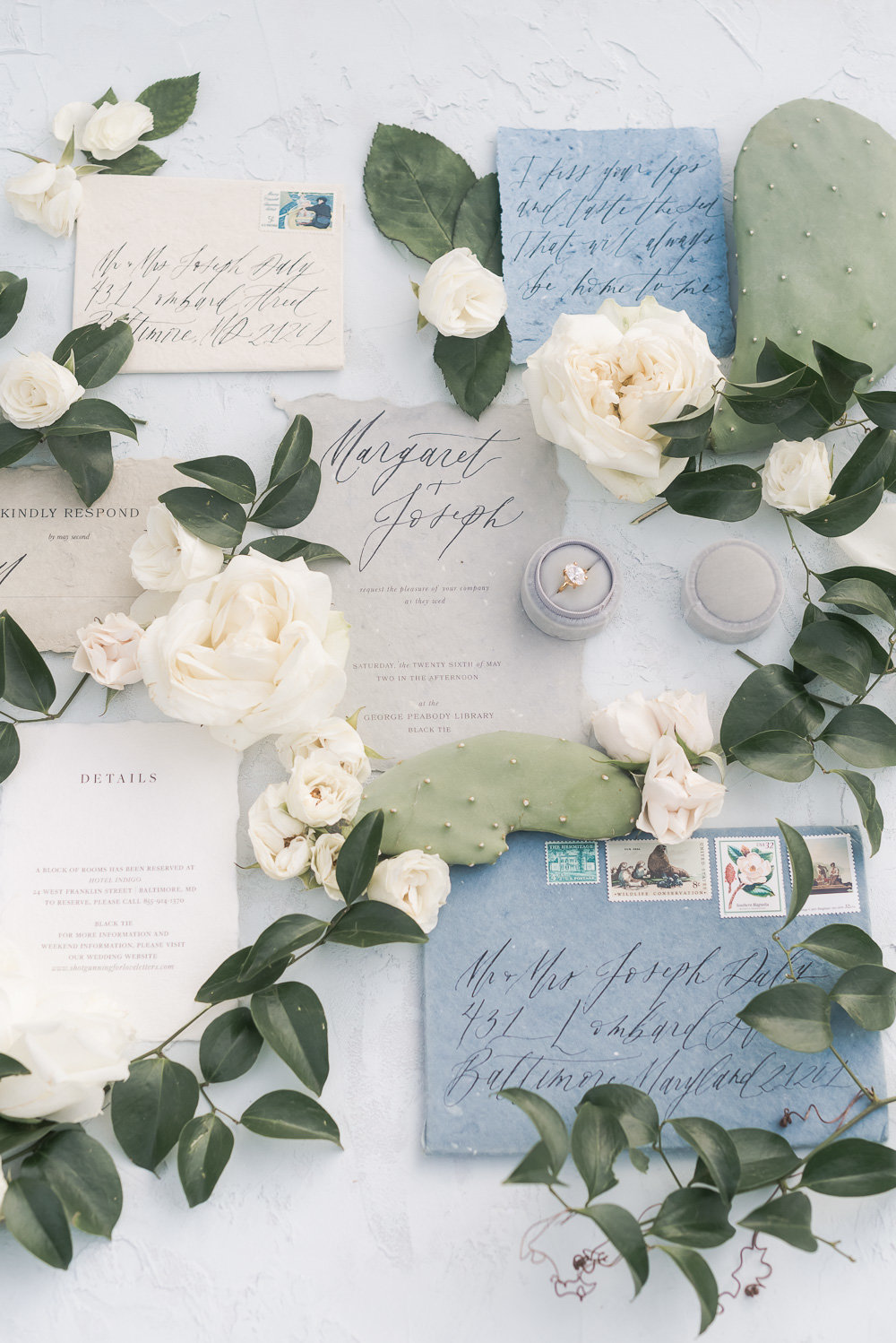 Three blue envelopes for wedding invitations