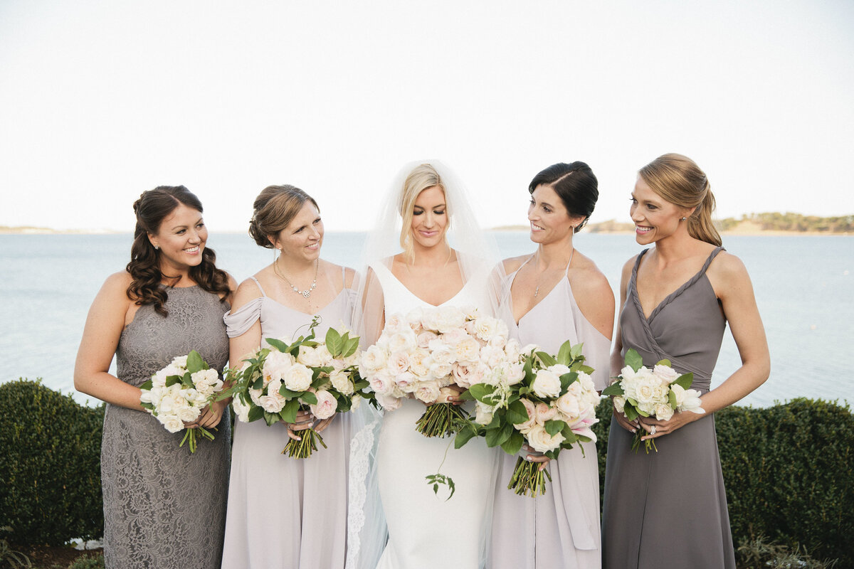 Whitney Bischoff and her bridesmaids in gray bridesmaids dresses