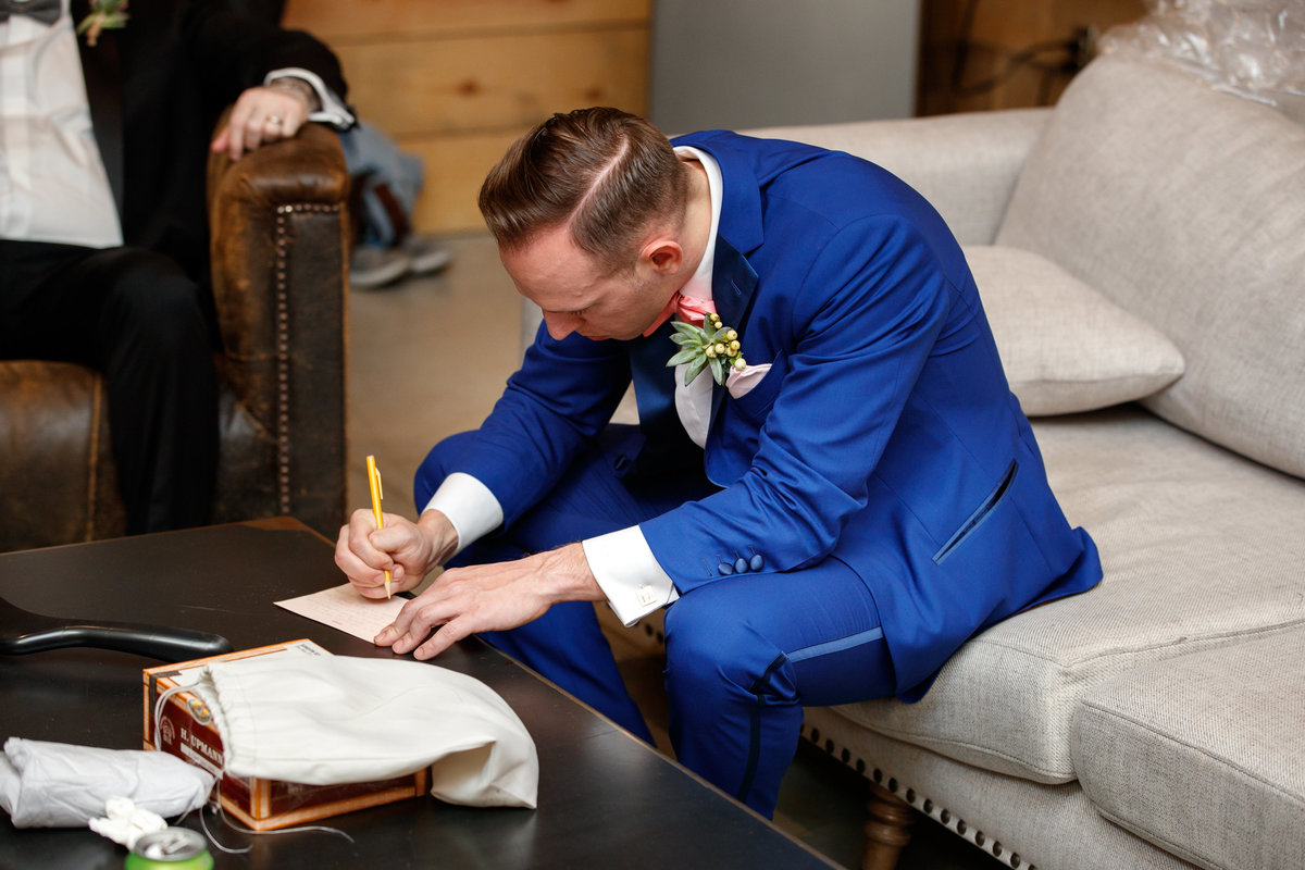 Austin wedding photographer addison grove wedding photographer groom writing letter