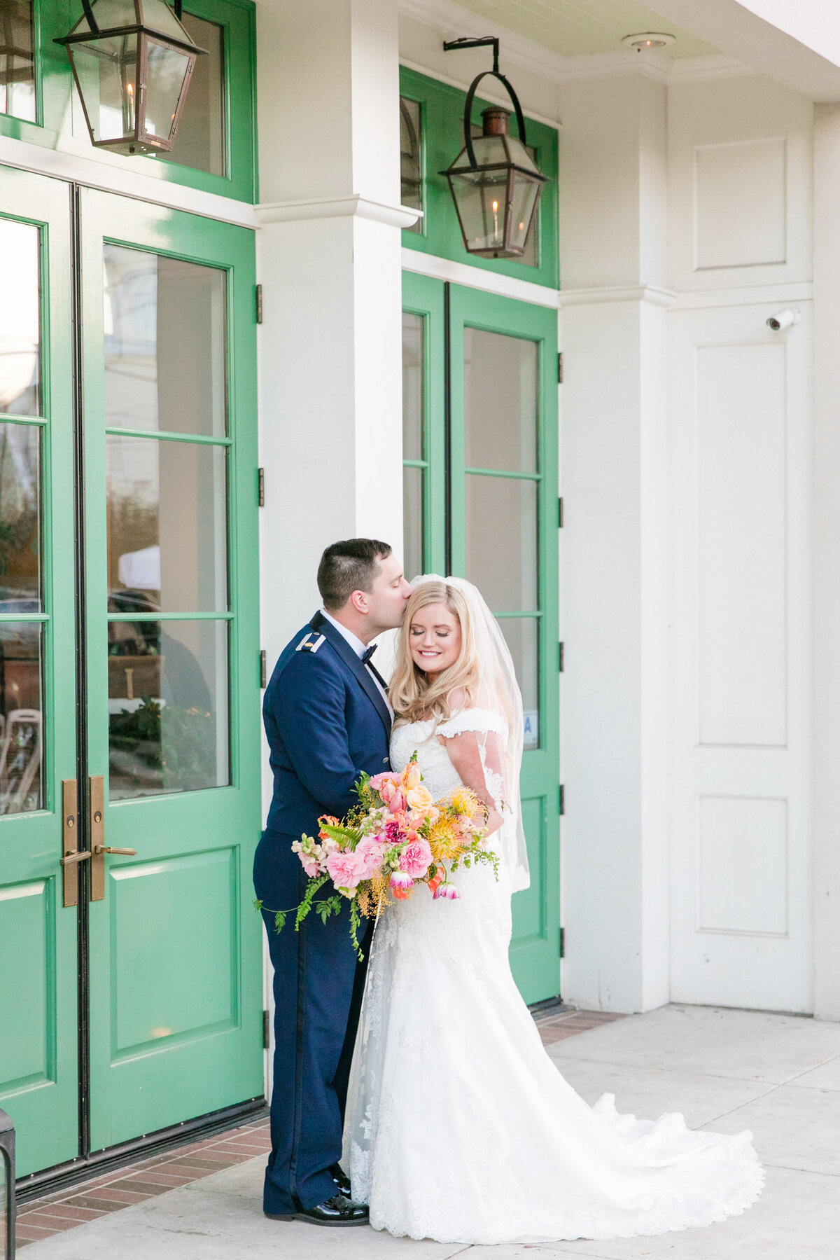 bride + groom i n front of cannon green charleston