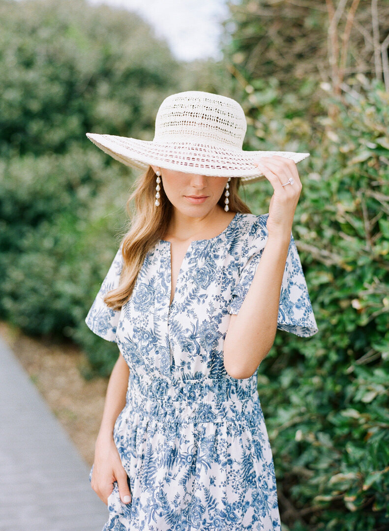 Girl in Blue Dress and Beach Hat Photo
