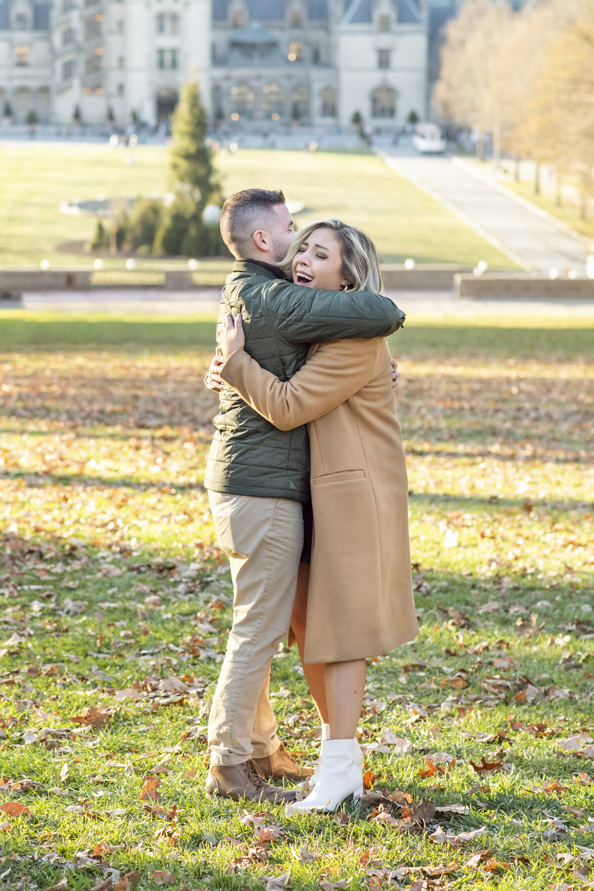 Couple hugging engagement proposal Biltmore Estate Asheville NC