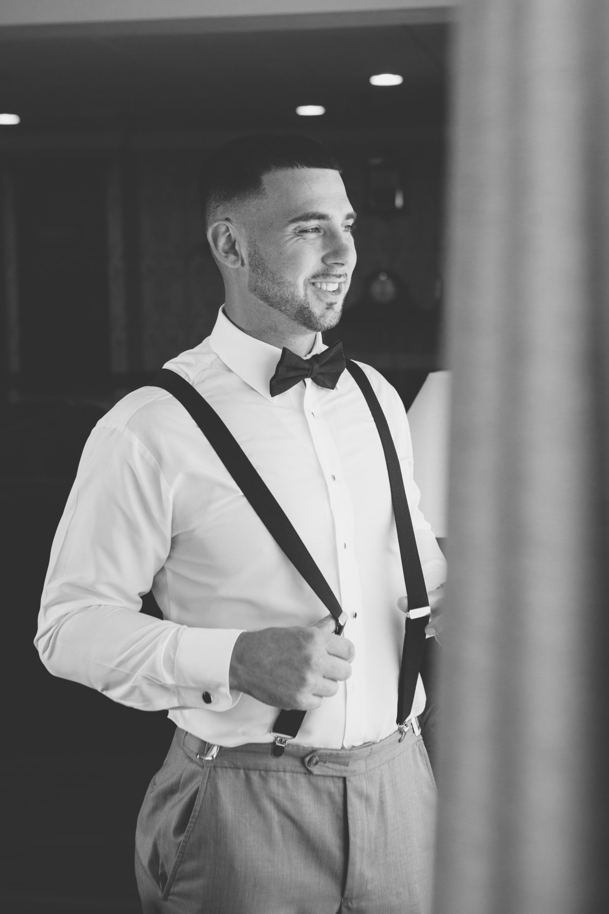 black and white photo of groom at Giorgios Baiting Hollow wedding