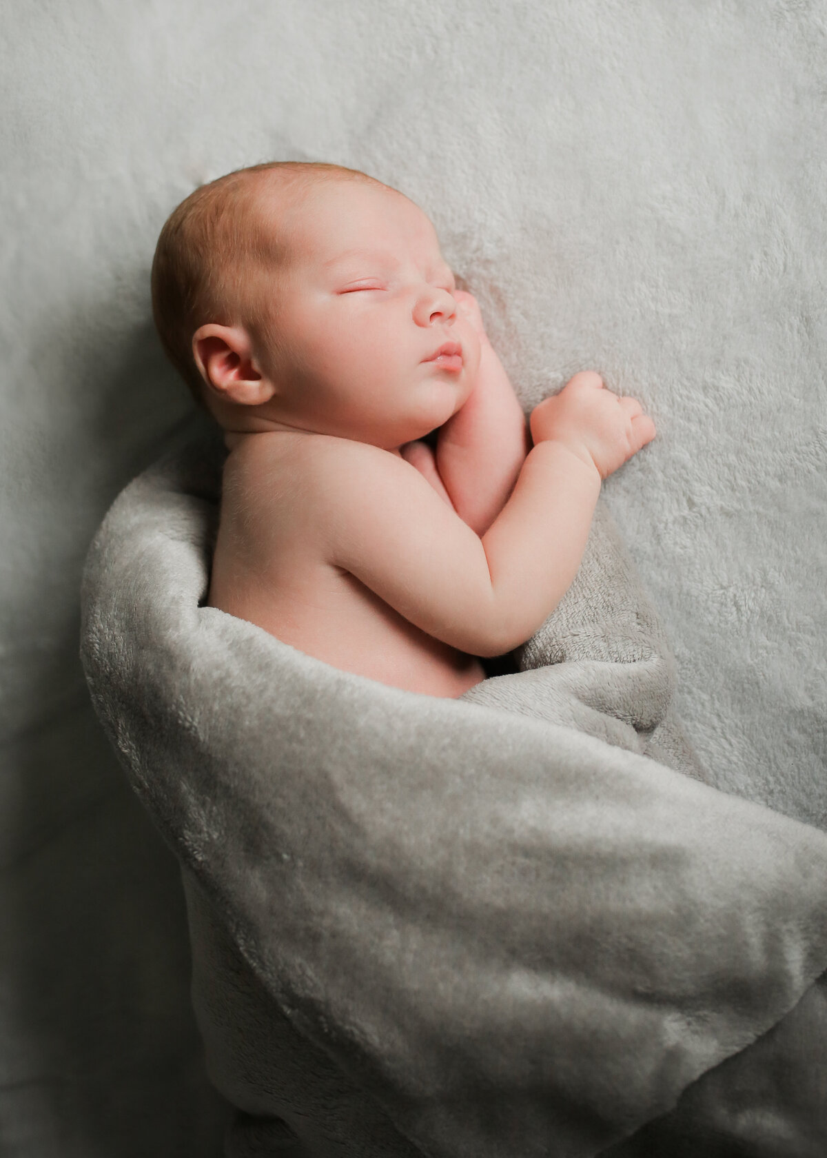 A perfect gift for new parents, a gift voucher for a newborn photo shoot.