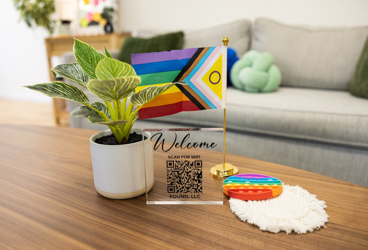 lgbtqia+-flag-in-therapist-office-during-brand-photography-session-in-baltimore-maryland
