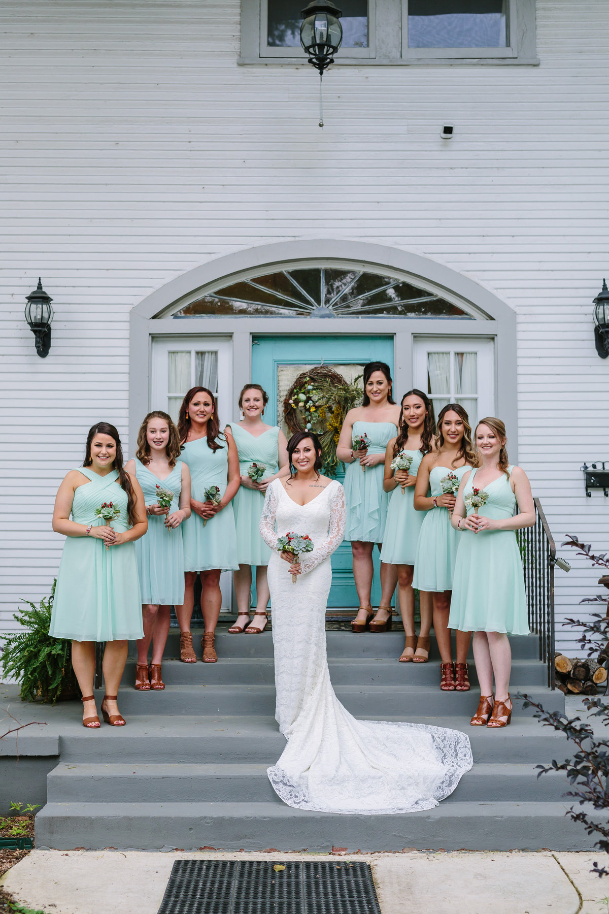 bridal party standing on steps of airbnb house rented for getting ready for her wedding in San Antonio