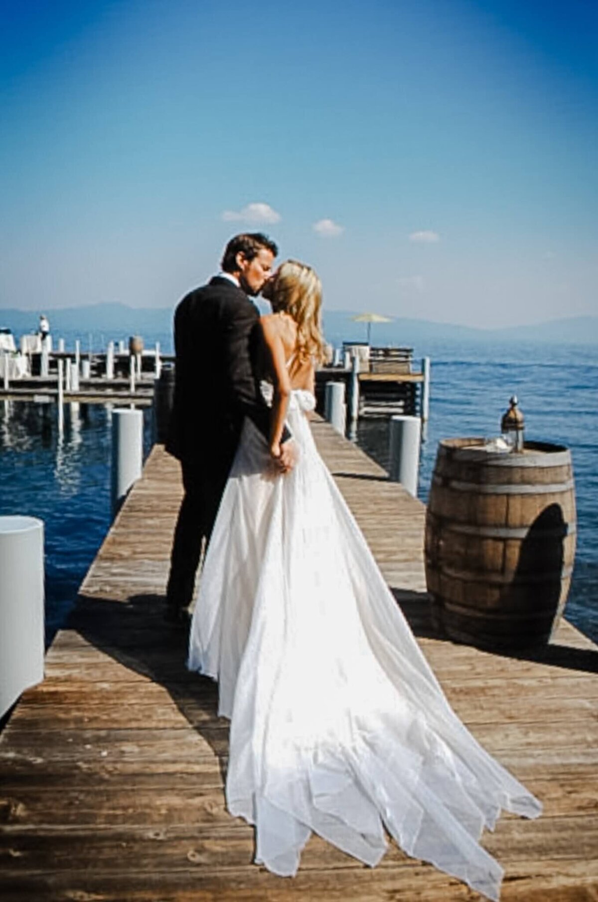 Couple kissing on pier at private residence now Zuckerberg residence at Lake Tahoe
