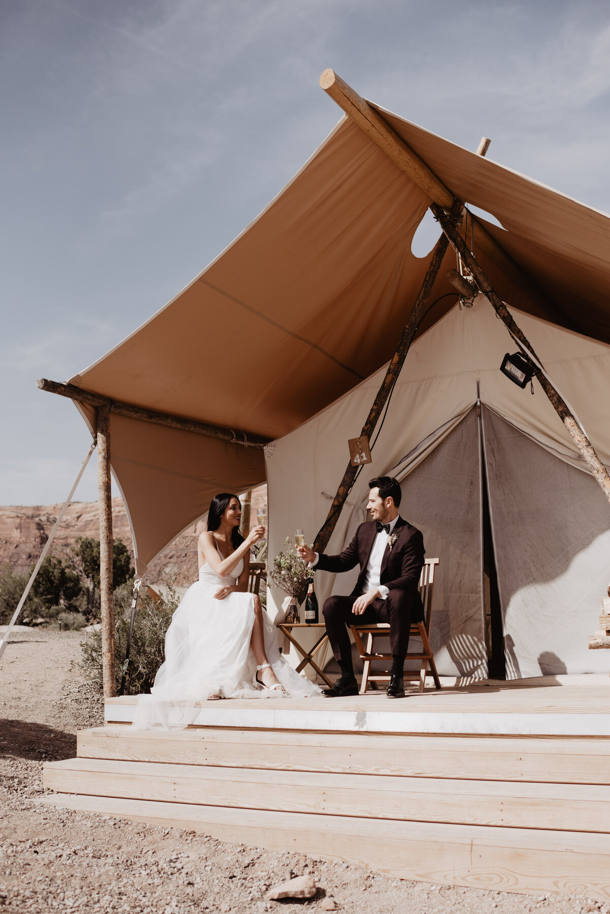 Utah elopement photographer captures couple celebrating with champagne
