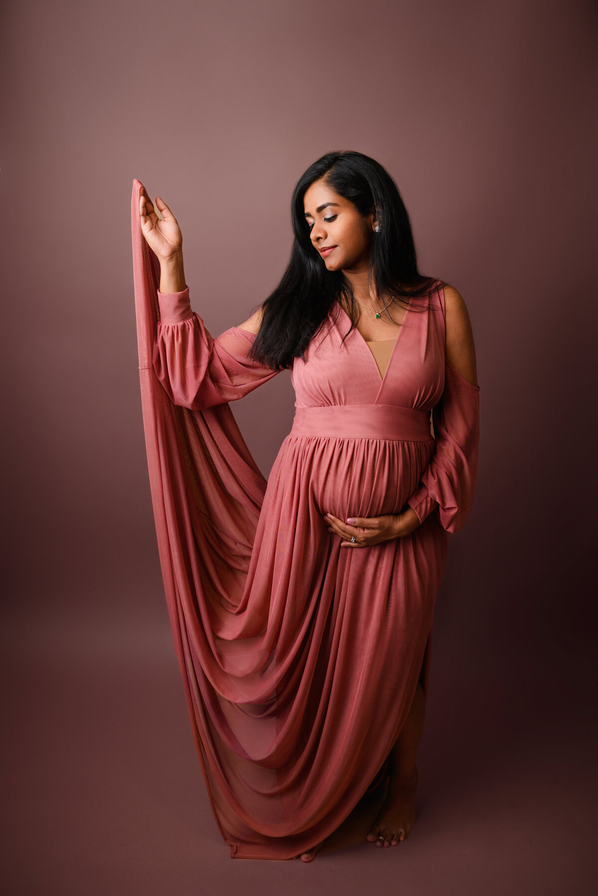 Pink maternity gown at seattle photography studio