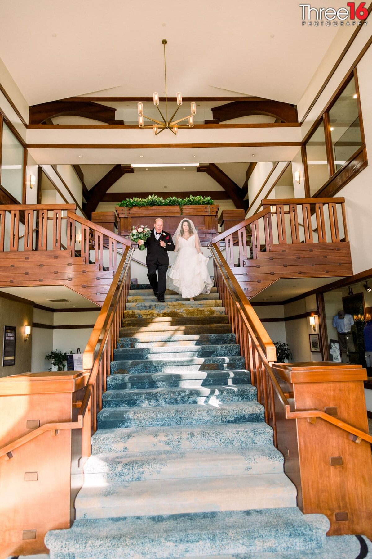 Bride and her father begin the descent down the Coto de Caza Golf & Racquet Club staircase