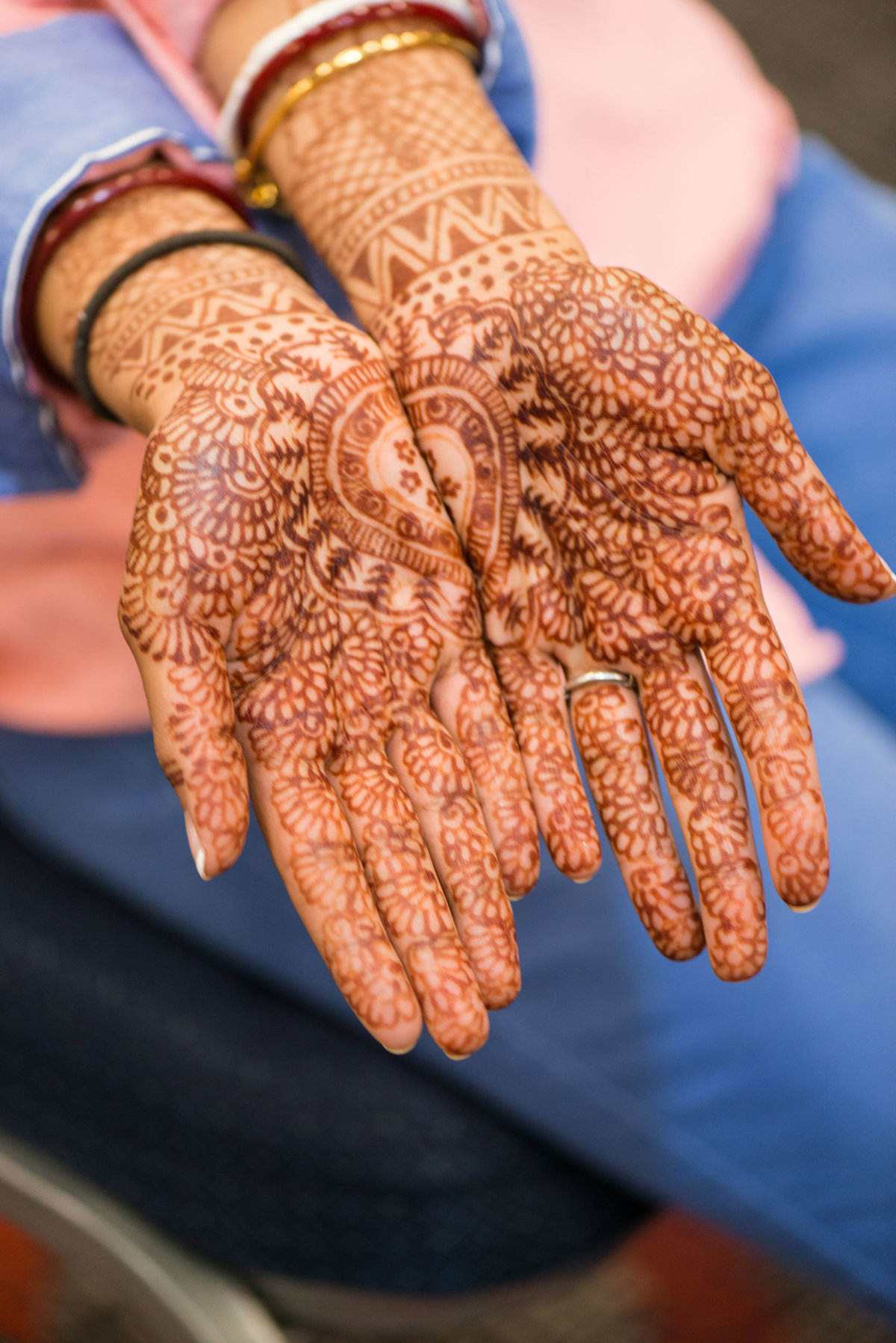 bride's hands covered with hennas at Huntington Hilton