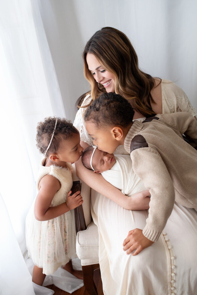 Newborn session of baby girl and siblings