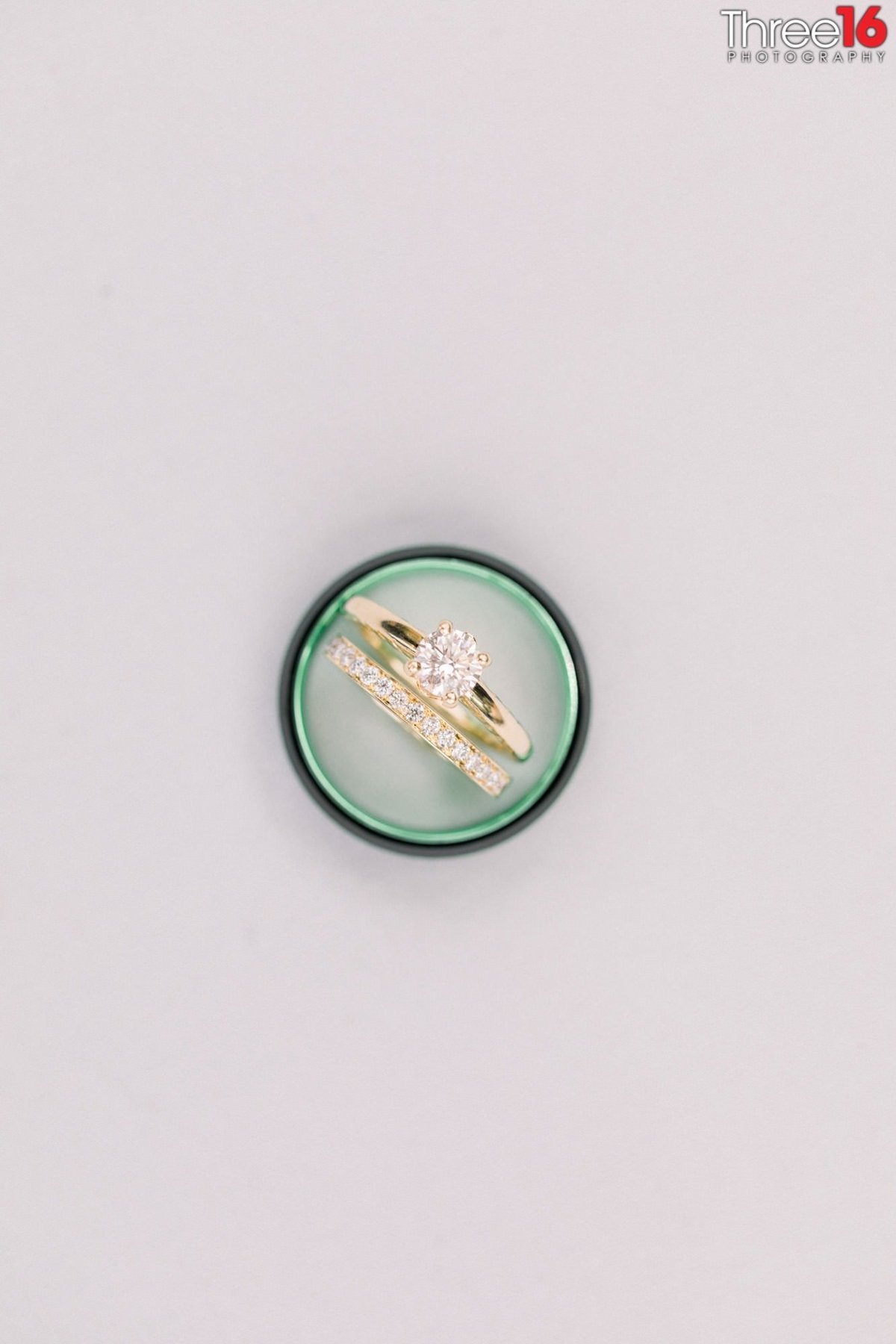 Bride's wedding ring sits inside her Groom's wedding ring