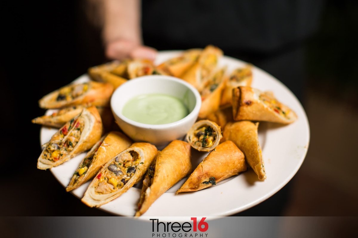 A TexMex spring roll appetizers are served at an Orange County wedding reception