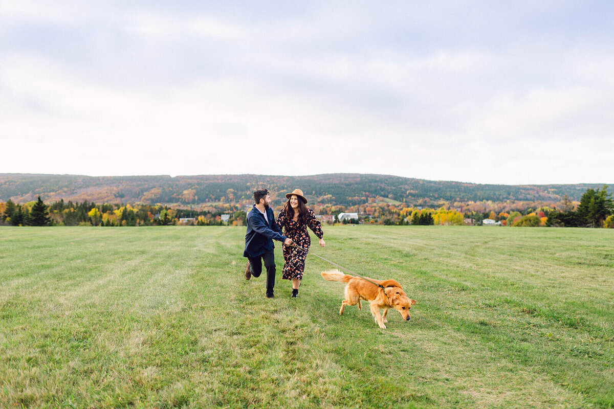 couple-in-feild-with-dog