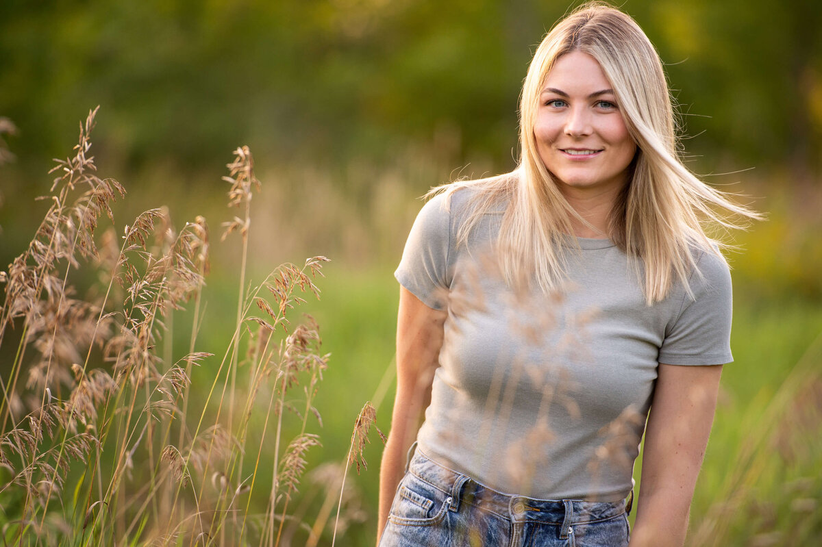 Ottawa family photography of an adult blonde teen smiling at sunset